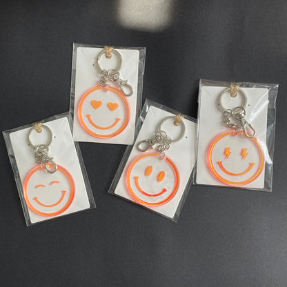 porte-clés happy face smiley holographiques orange