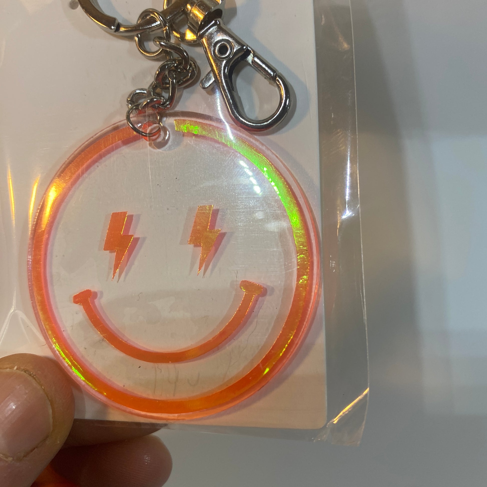 porte-clés happy face smiley holographiques orange